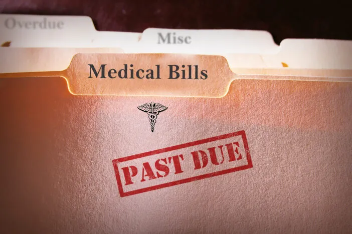 A "Medical Bills" file folder stamped with "PAST DUE".